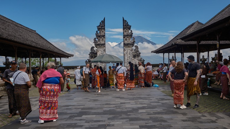 People waiting to take pictures at the Gates of Heaven in Bali