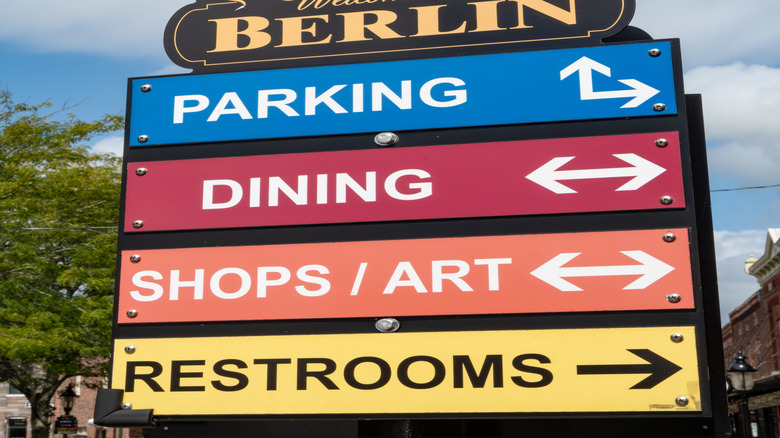 A sign saying "welcome to Berlin" with the slogan "America's Coolest Small Town" on the top