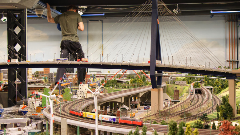 model maker stands atop a train junction at Hamburg's Miniature Wunderland