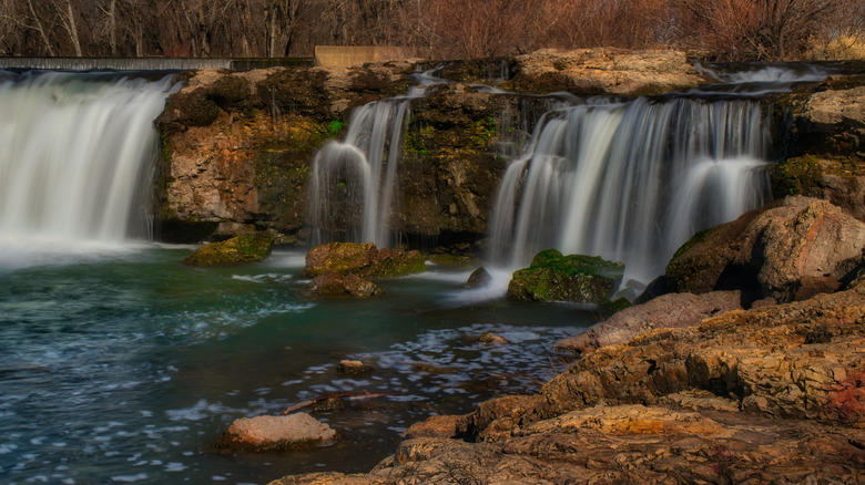 Water falling down rocky ledges at Grand Falls in Joplin, Missouri