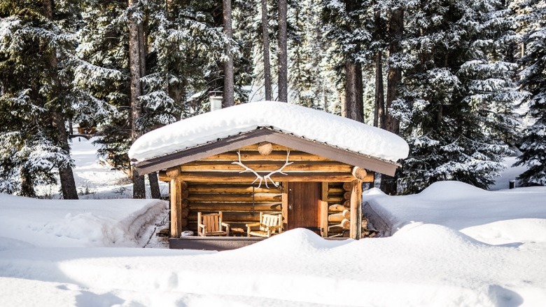 Lone Mountain Ranch cabins at night covered in snow