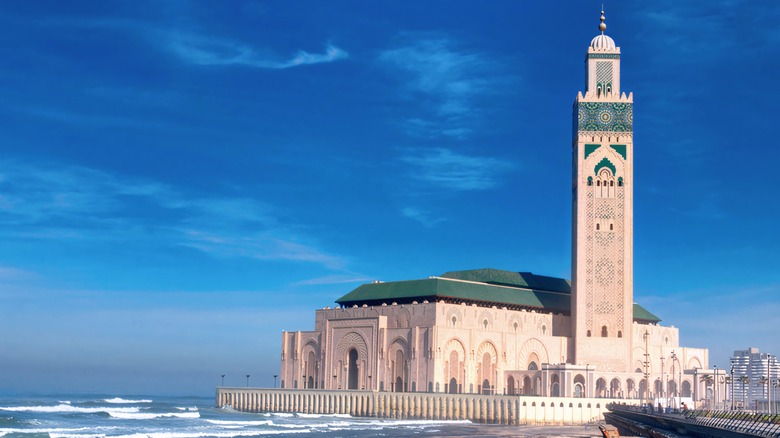 The Hassan II Mosque next to the blue ocean in Casablanca