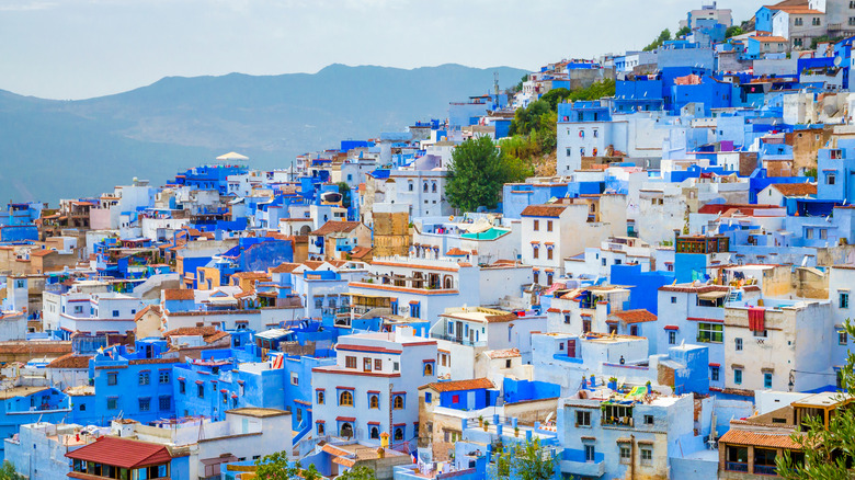 The blue buildings of Chefchaouen, Morocco, with a mountainous backdrop