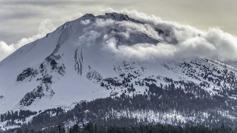 Snow and clouds surrounding a peak in Lassen Volcanic National Park