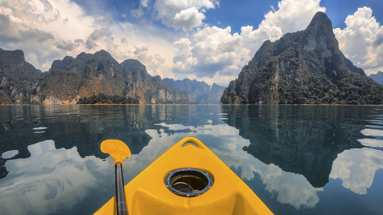 POV from yellow kayak in Khao Sok National Park