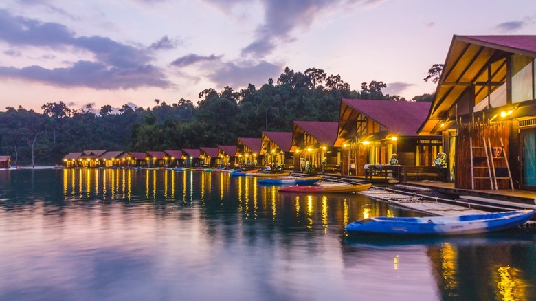 Floating bungalows with kayaks out front at 500 Rai Resort, Thailand