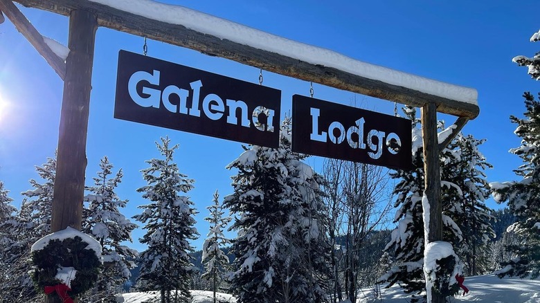 Galena Lodge sign covered in snow with Christmas wreaths