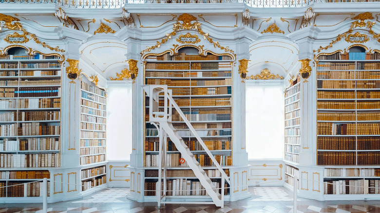 Ornate gold and white bookshelves in Admont Abbey Library, Austria