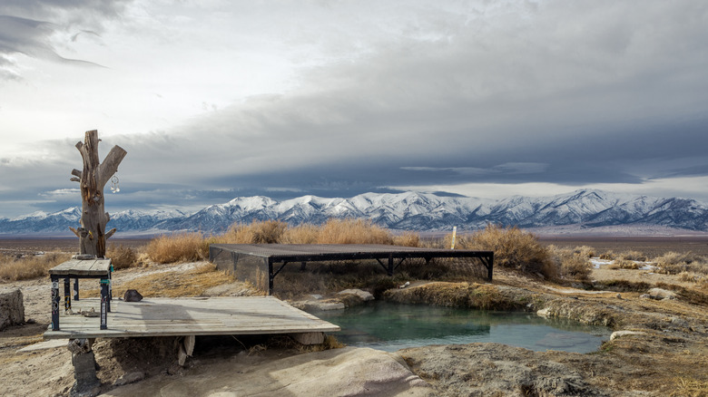 Spencer Hot Springs with views of nearby mountains