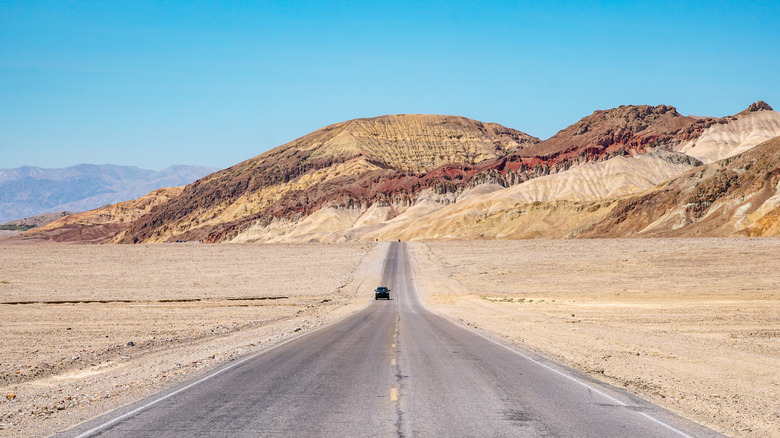 Paved road in the desert leading to Death Valley