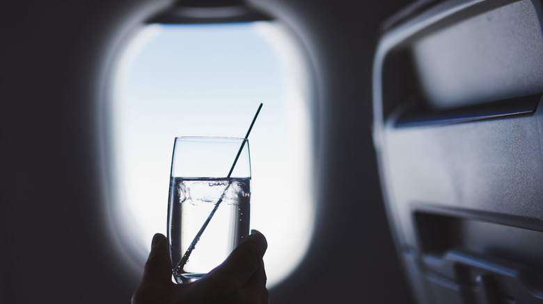 Glass of water on airplane