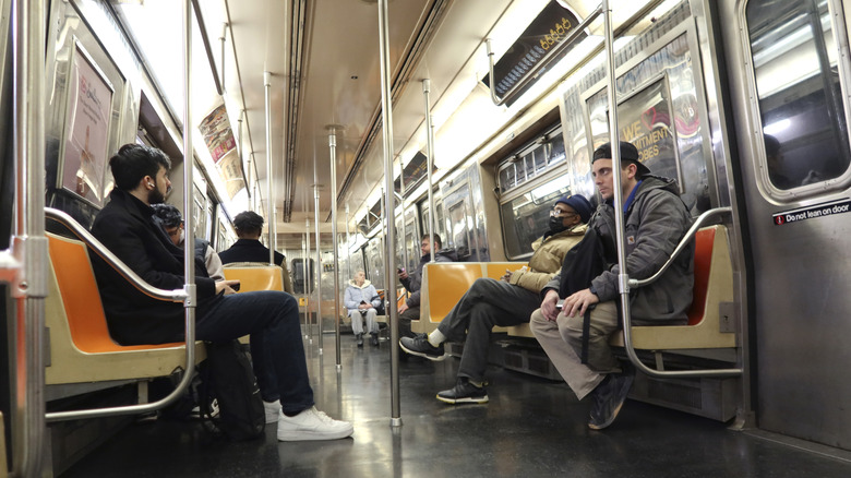 Passengers inside the D train, NYC subway