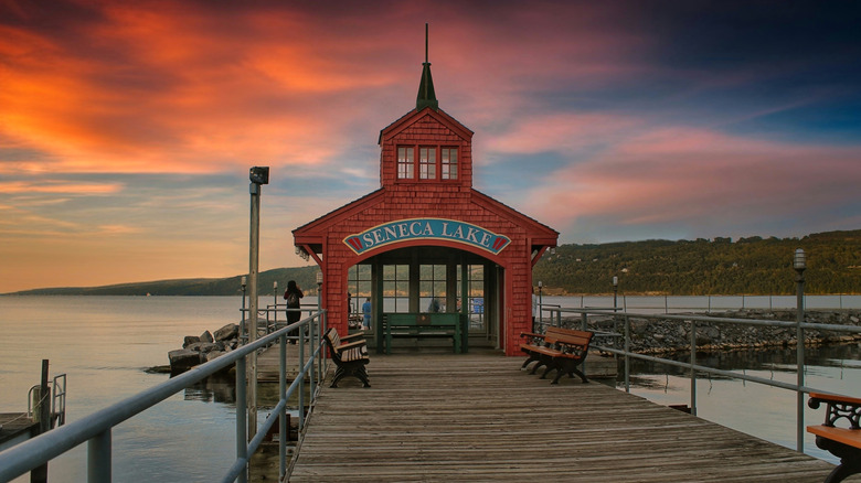 Red boathouse on Seneca Lake with sunset