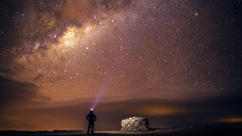 Traveler beneath Milky Way in the Atacama Desert, Chile