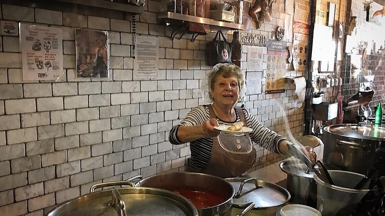 A grandma cooking food at Enoteca Maria's