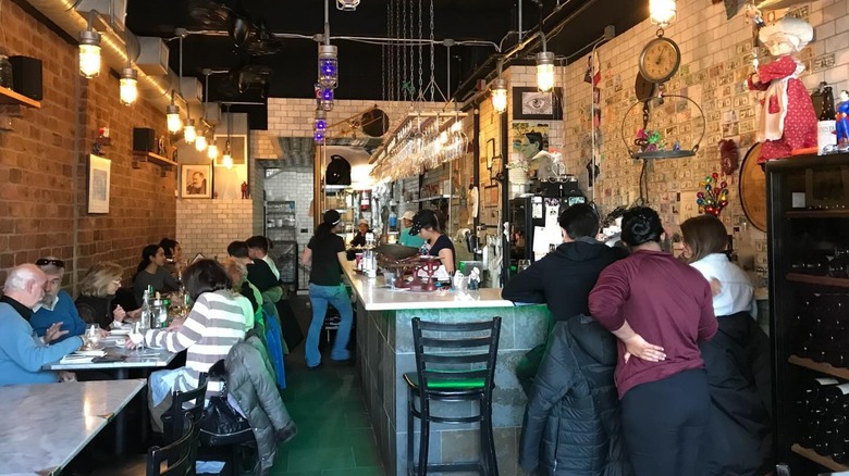 People dining at Enoteca Maria's in New York