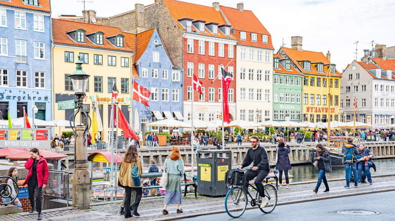 Biking along the water in Nyhavn district in Copenhagen