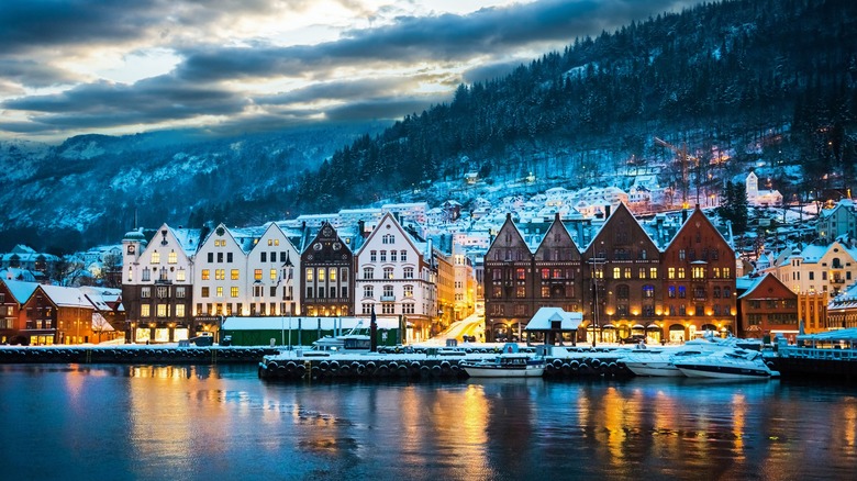 Snow-covered buildings near the water in Bergen, Norway