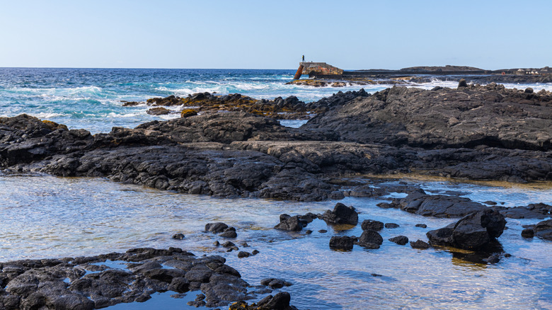 Panoramic view of Keahole Point coast where lava rock meets ocean