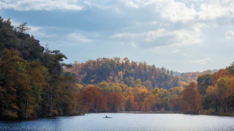 Kayak on Broken Bow Lake surrounded by fall foliage