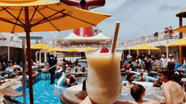 Pina Colada in front of crowded pool