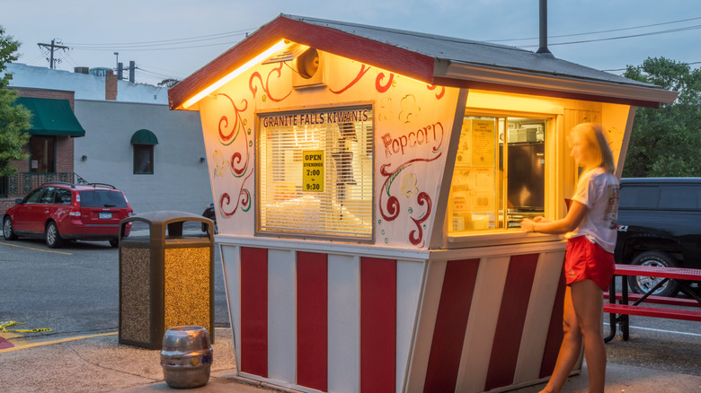 A woman ordering at the Kiwanis Popcorn stand in Granite Falls, Minnesota