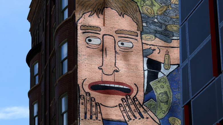 Mural of person and money in Chicago's Wabash Arts Corridor