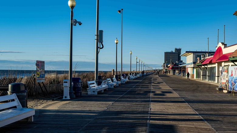 View of the Rehoboth boardwalk with beach in distance in Delaware