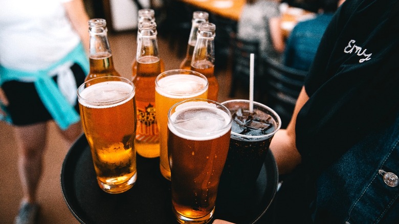 People clinking glasses of beer