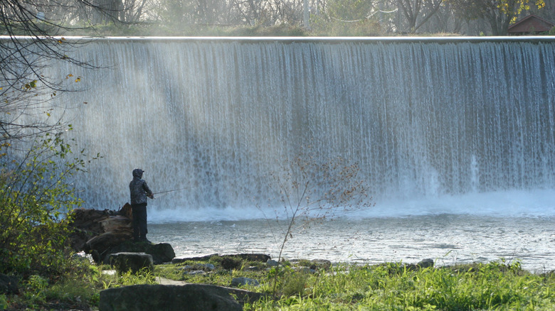 Lanesboro Stone Dam outlook with a person fishing