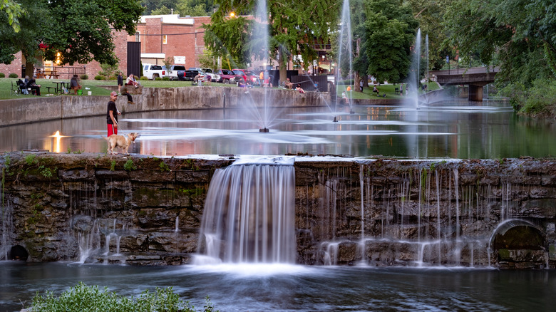 People congregate around Sager Creak that passes through Siloam Springs