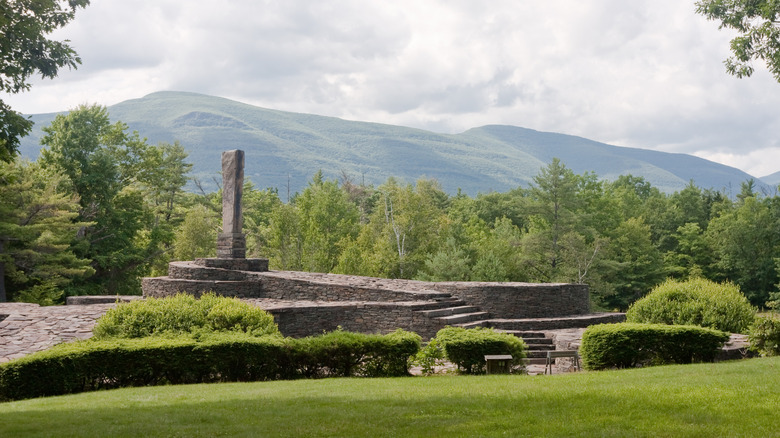 A beautiful view of Opus 40 sculpture park with mountains.