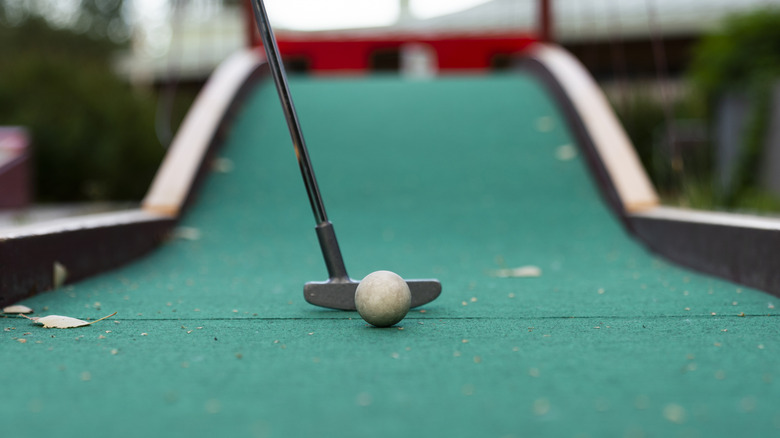 Lining up a shot on a mini-golf course