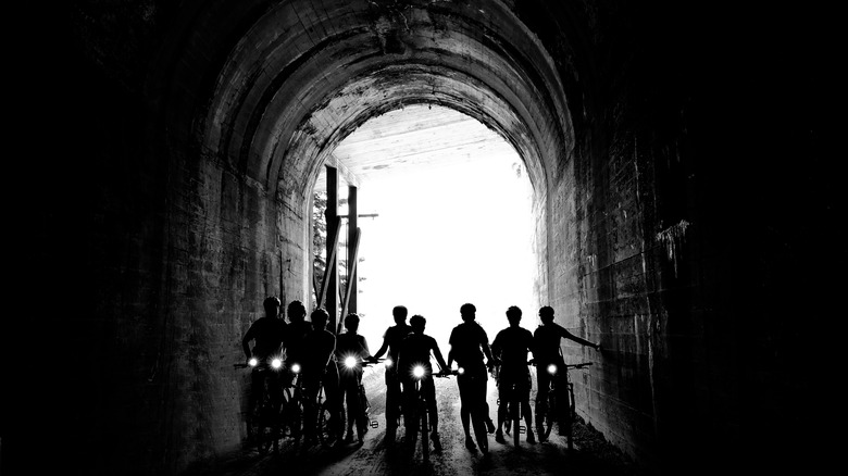 Bikers traveling through a Tunnel on the Route of the Hiawatha