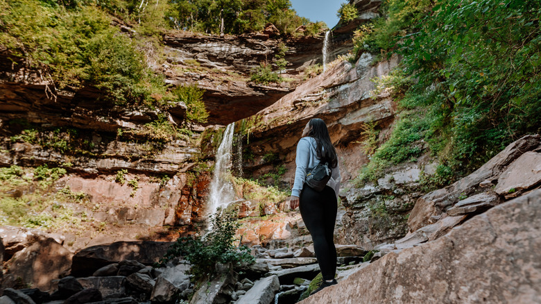 Woman looking at Kaaterskill Falls