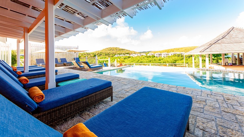 Pool side beds overlooking the bay at the Escape at Nonsuch Bay Resort