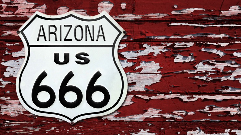 A closeup of an Arizona US 666 sign