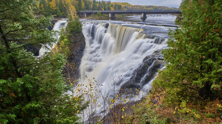 Kakabeka Falls in the early autumn surrounded by trees