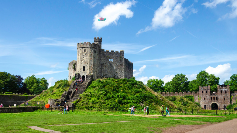 Visitors exploring the Cardiff Castle keep on a sunny day