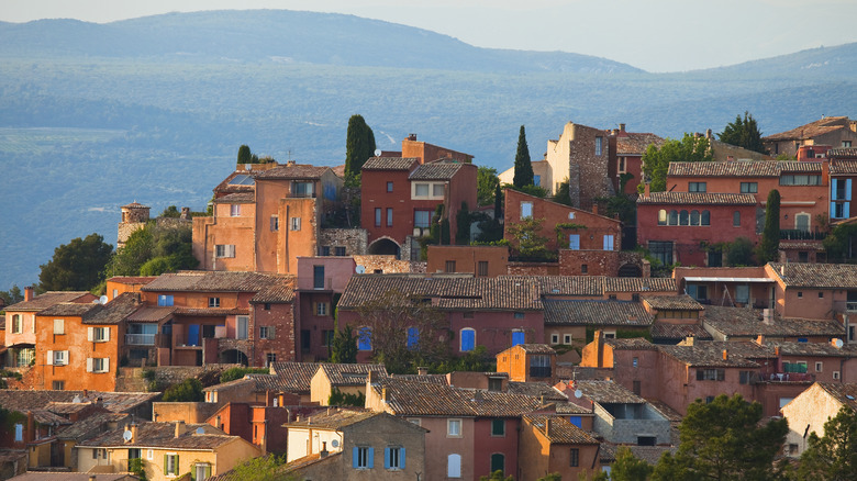 Red and orange town of Roussillon perched on a hill top