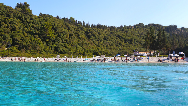 View facing Vrika Beach with sunbathers on Antipaxos Island in Greece