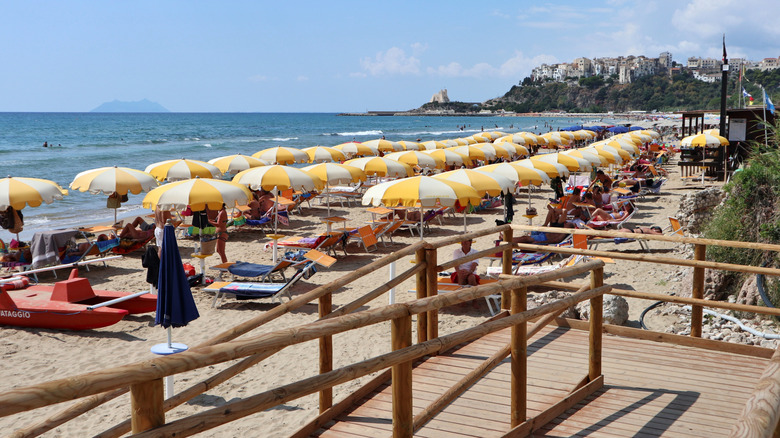 Yellow beach umbrellas on a lido in Sperlonga, Italy