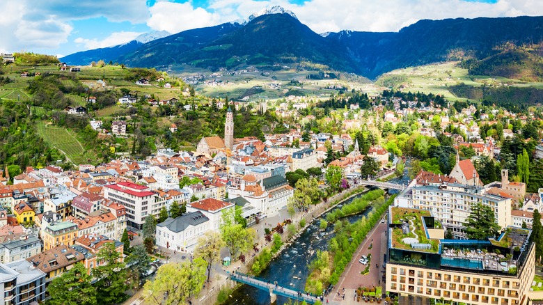 Alpine city near mountains and a river