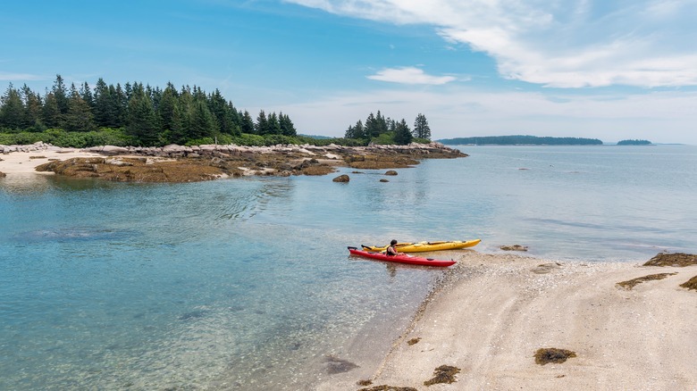 Kayakers on beach on Deer Isle