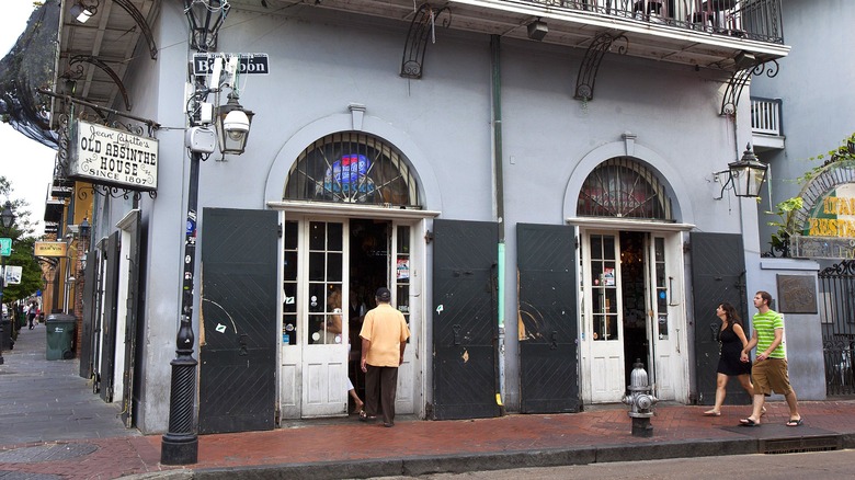 Man walks into Old Abinsthe House in New Orleans, Louisiana