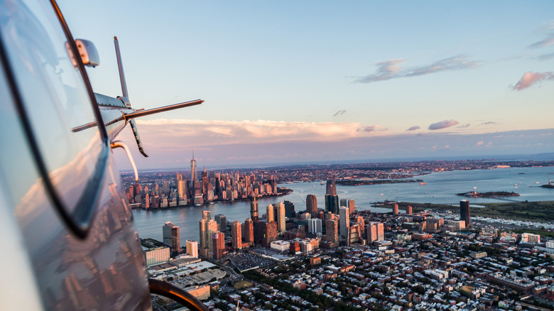 Helicopter aerial view flying away from Manhattan