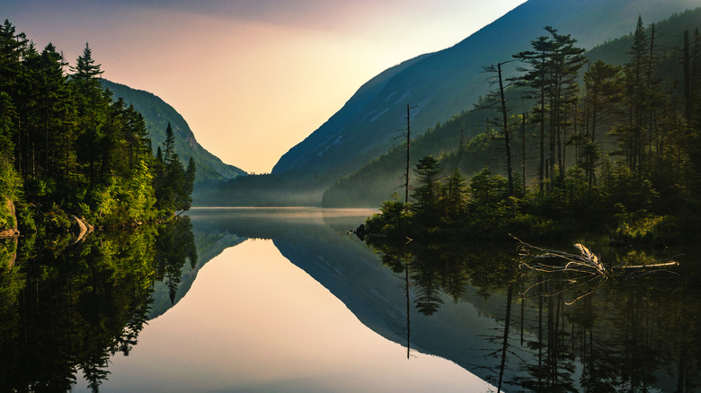 Sunset reflections on Adirondack lake in the mountains