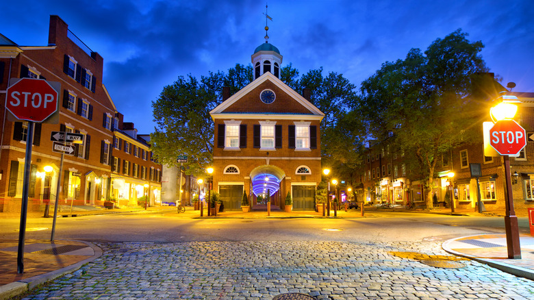 Lit-up Society Hill street at night