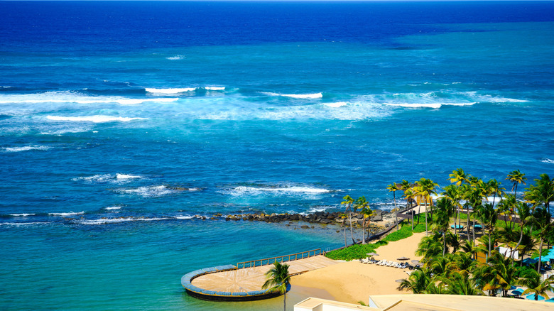 The golden sands and turquoise waters of El Escambrón beach in Puerto Rico