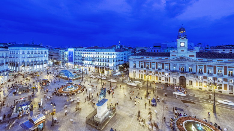 Puerta del Sol at night with blue lights in Madrid, Spain